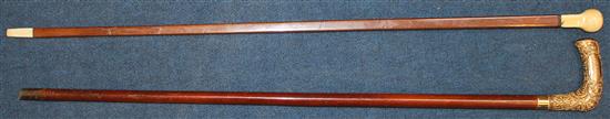 A 19th ivory handled square section walking cane & another